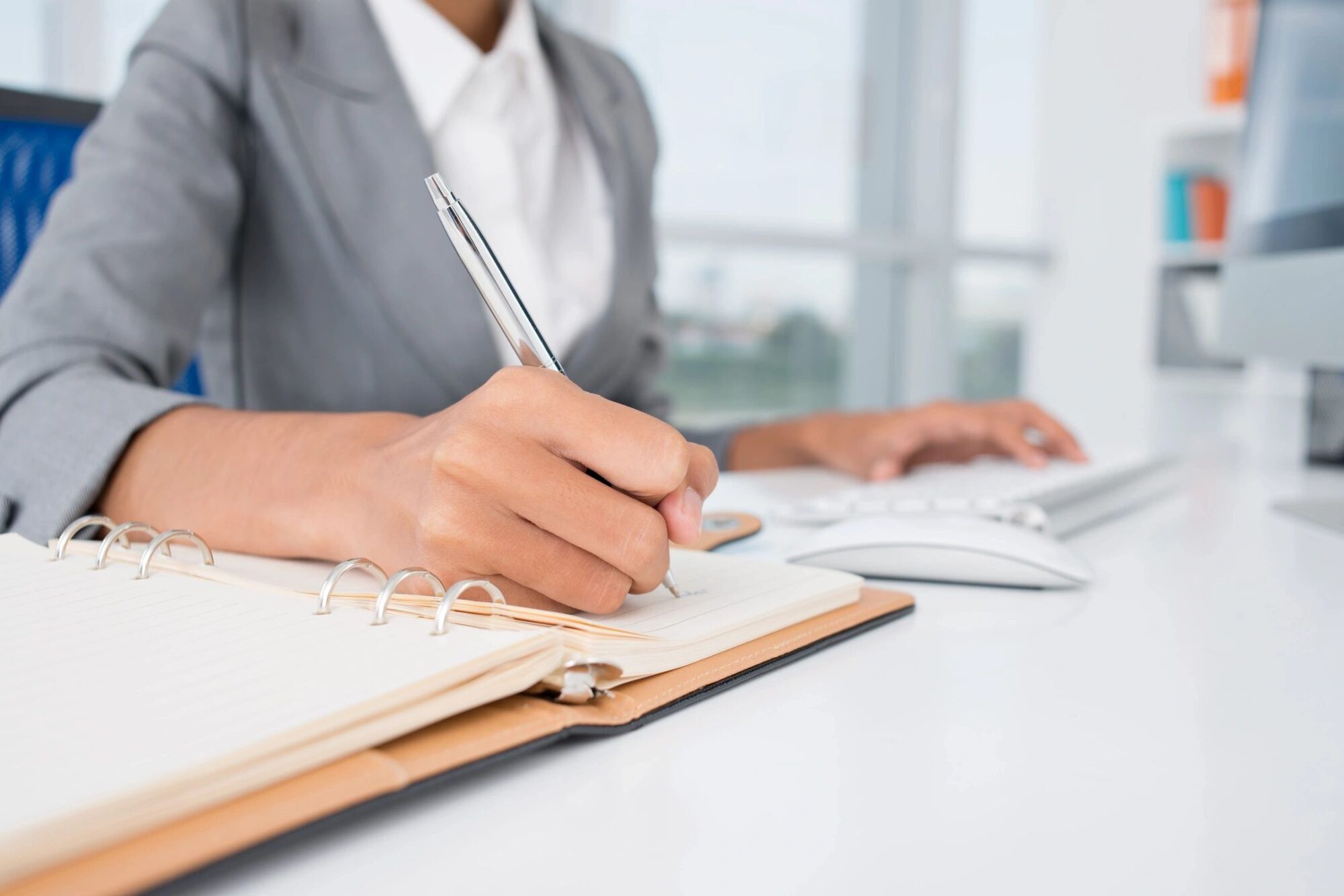 lady writing at a desk